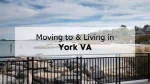 A view of Yorktown Beach from behind a railing with text that reads “moving to and living in York VA”